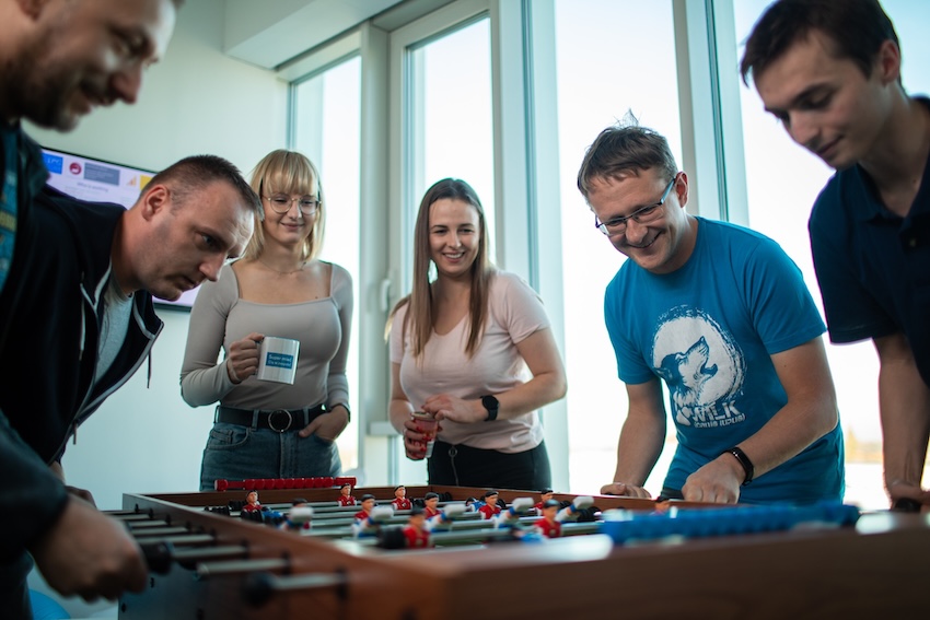 The Droptica team is having a break and playing a football game.