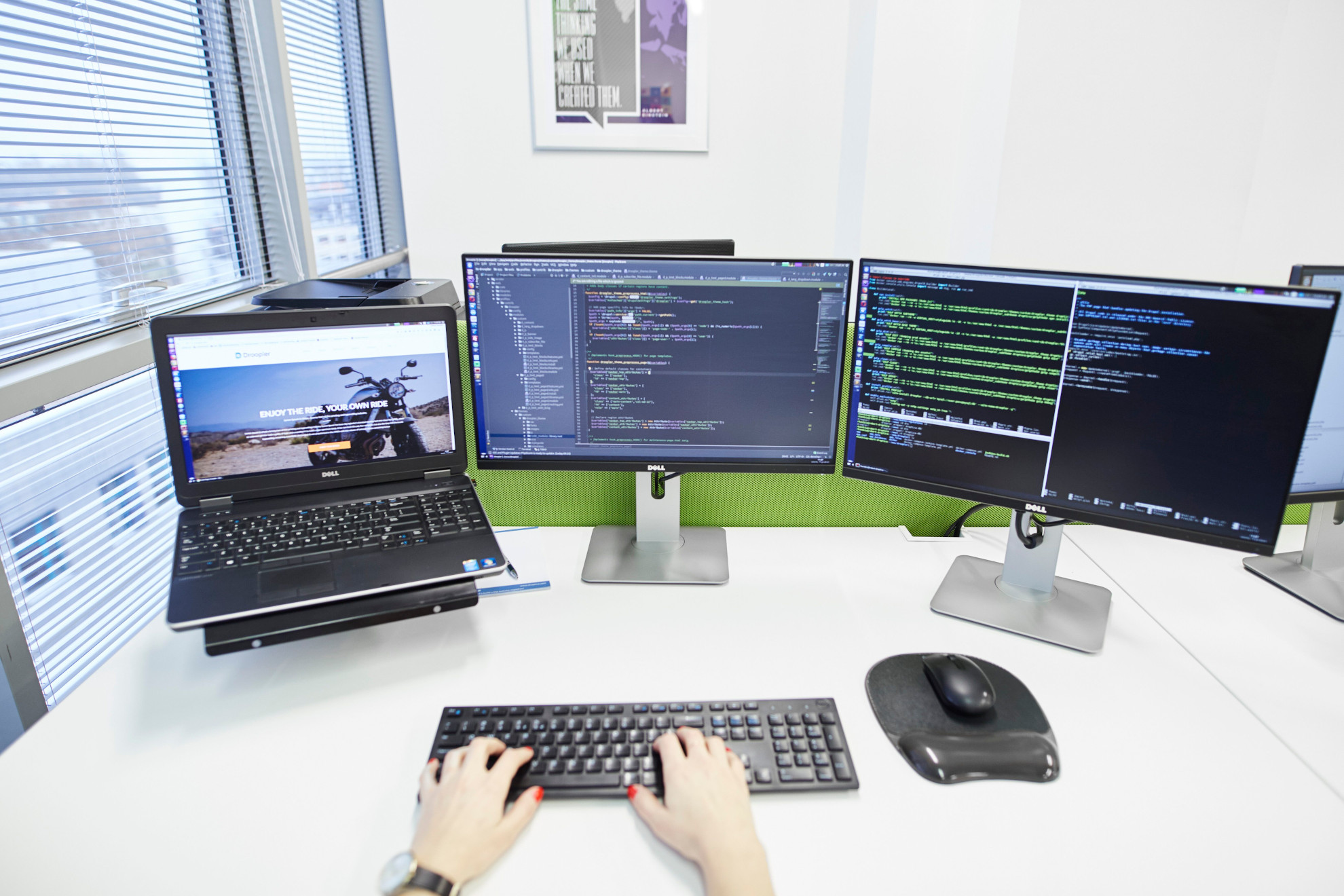 A picture of a developer's workspace, including all the equipment