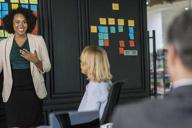 A businesswoman explains her ideas on the scrum meeting