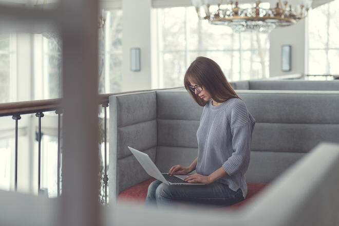 Drupal-based Project main blog article photo woman with a laptop