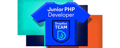 a blu t-shirt with "junior PHP" and Roptica logo printed on it. at the background, three squares, colored orange, black and teal are visible.